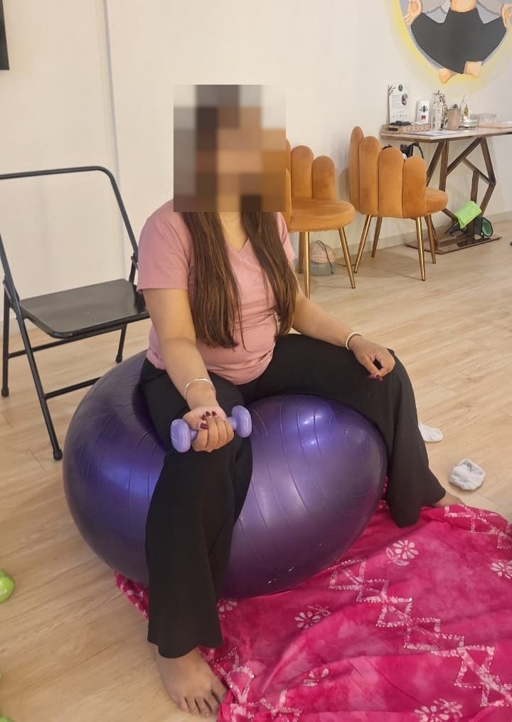 Gentle prenatal workout and fitness exercise with stability ball at Aura Studio by Yogtatvah Wellness & Beyond